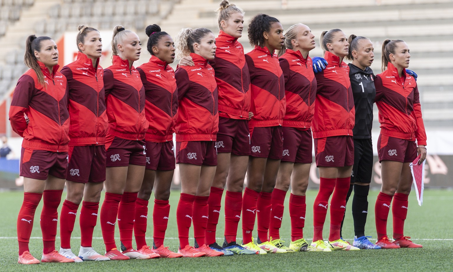 The Swiss players sing the Swiss national anthem, from left, Ramona Bachmann, Sandy Maendly, Alisha Lehmann, Eseosa Aigbogun, Luana Buehler, Rahel Kiwic, Coumba Sow, Irina Pando, Ana Maria Crnogorcevi ...