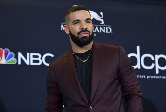 FILE - Drake poses at the Billboard Music Awards in Las Vegas on May 1, 2019. Police are investigating a shooting outside rapper Drake?s mansion that left a security guard seriously wounded. Authoriti ...