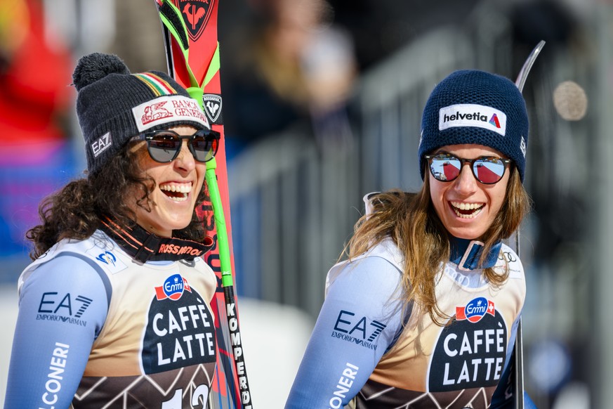 epa11160315 Second placed Federica Brignone (L) of Italy and winner Marta Bassino of Italy celebrate on the podium for the Women&#039;s Downhill race at the FIS Alpine Skiing World Cup in Crans-Montan ...