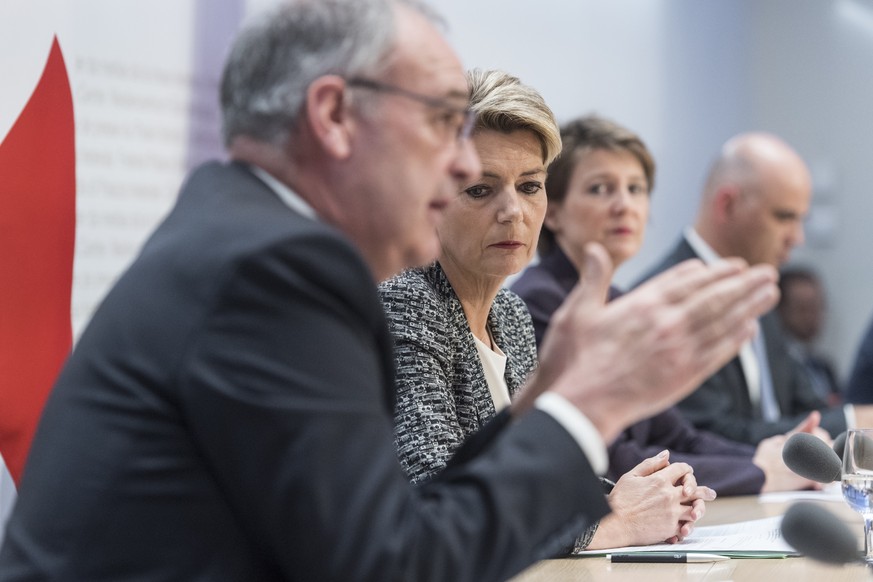 Swiss Federal president Simonetta Sommaruga, second right, and from left, Federal councillors Guy Parmelin, Karin Keller-Sutter and Alain Berset brief the media about the latest measures to fight the  ...