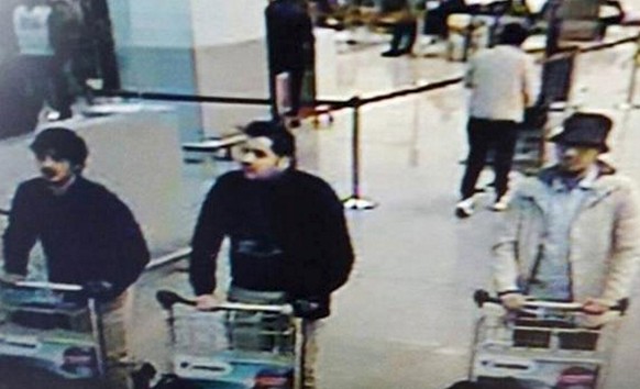 This CCTV image from the Brussels Airport surveillance cameras made available by Belgian Police, shows what officials believe may be suspects in the Brussels airport attack on March 22, 2016. The Belg ...