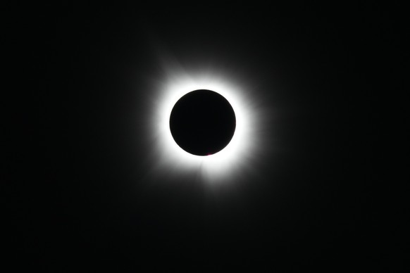 A total solar eclipse is visible from Arlington, Texas, Monday, April 8, 2024. (AP Photo/Julio Cortez)