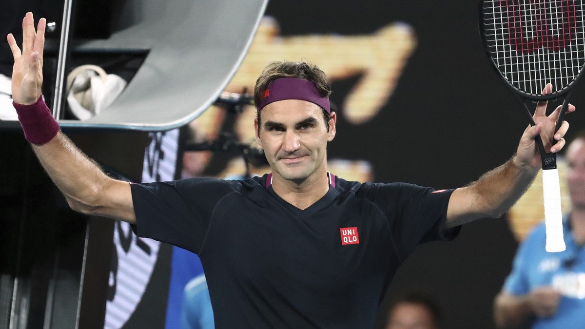 Switzerland's Roger Federer celebrates after defeating Serbia's Filip Krajinovic in their second round singles match at the Australian Open tennis championship in Melbourne, Australia, Wedne ...