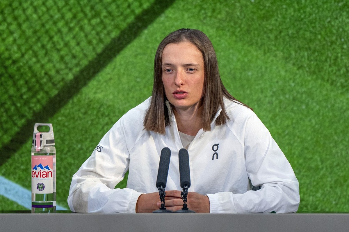 Poland's Iga Swiatek speaks during a post match news conference after losing to Yulia Putintseva, of, Kazakhstan, at the Wimbledon tennis championships, Saturday, July 6, 2024, in London. (Joe To ...