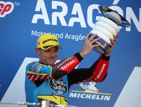 epa08755168 British Moto2 rider Sam Lowes of EG 0,0 Marc VDS team celebrates his win on the podium at the motorcycling Grand Prix of Aragon at Motorland circuit in Alcaniz, Spain, 18 October 2020. EPA ...