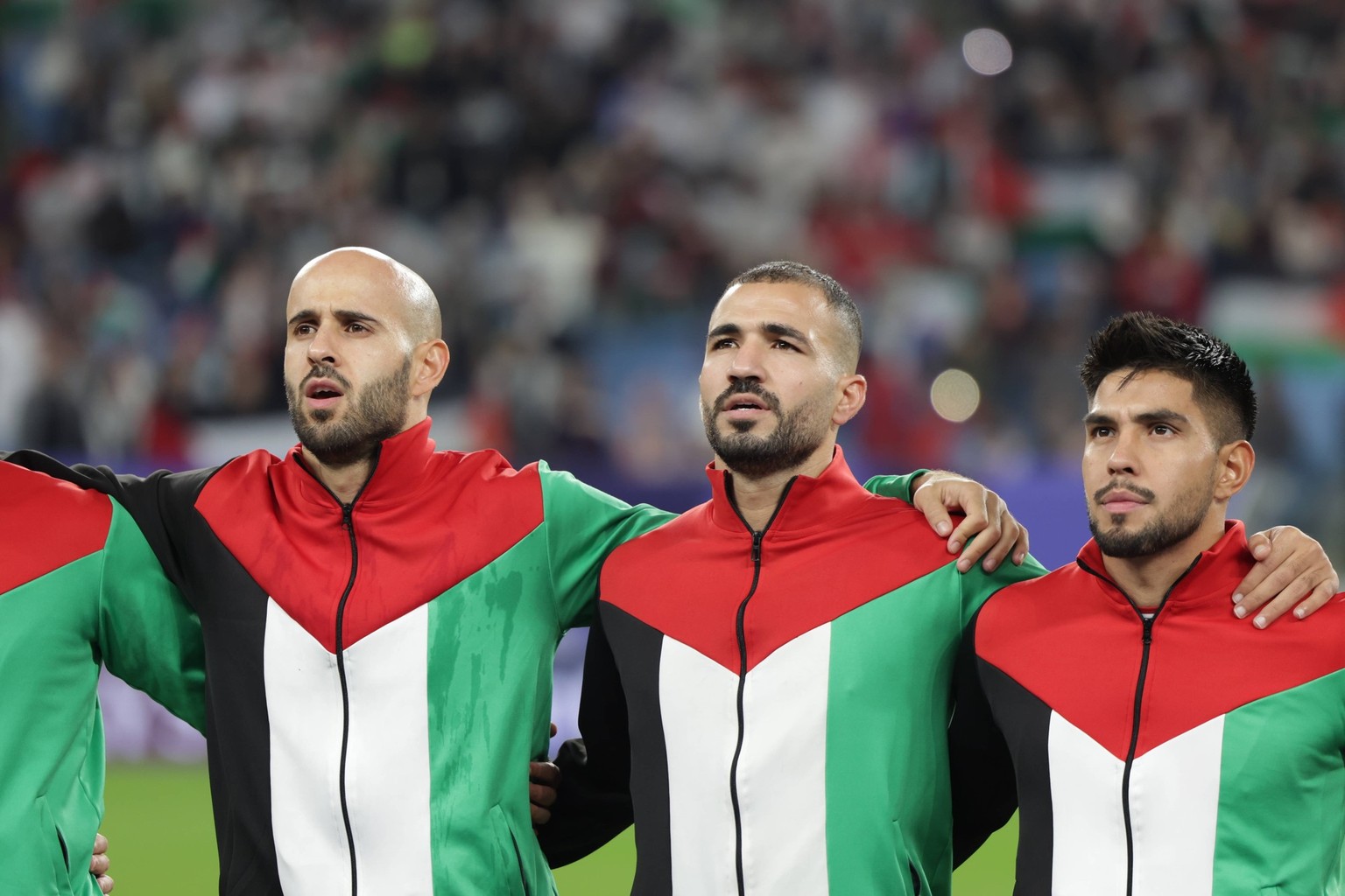 Qatar, Al Wakrah 18 January 2024 - players of Palestine sing the national anthem during the match between Palestine and United Arabs Emirates match during AFC Asia Cup 2023 match group stage at Al Jan ...