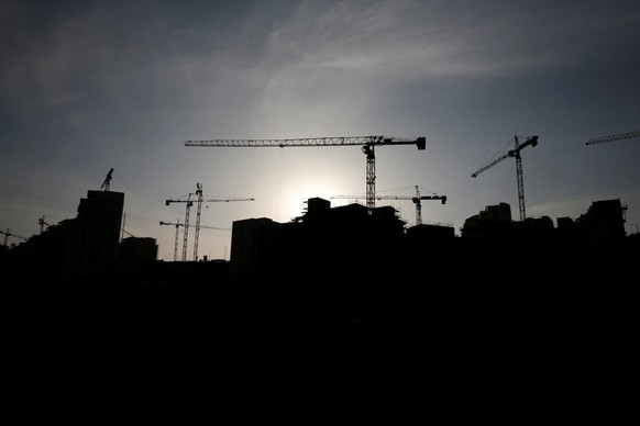 A construction site is silhouetted in the Israeli settlement of Har Homa, known to Palestinians as Jabal Abu Ghneim in an area of the West Bank that Israel captured in a 1967 war and annexed to the ci ...