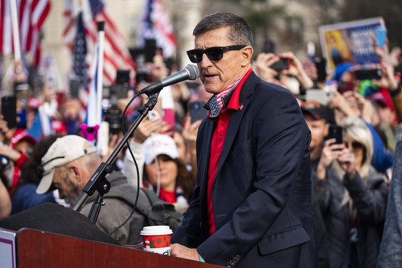 epa08879707 Former National Security Advisor and convicted felon Michael Flynn speaks to supporters of US President Donald J. Trump who gathered outside the Supreme Court to echo Trump&#039;s baseless ...