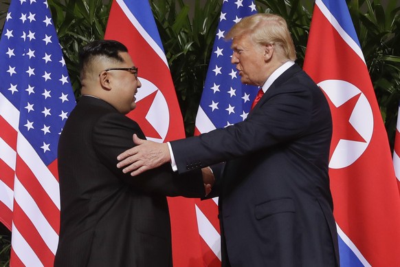 FILE - In this June 12, 2018 file photo, President Donald Trump shakes hands with North Korea leader Kim Jong Un at the Capella resort on Sentosa Island in Singapore. As he prepares to meet again Nort ...