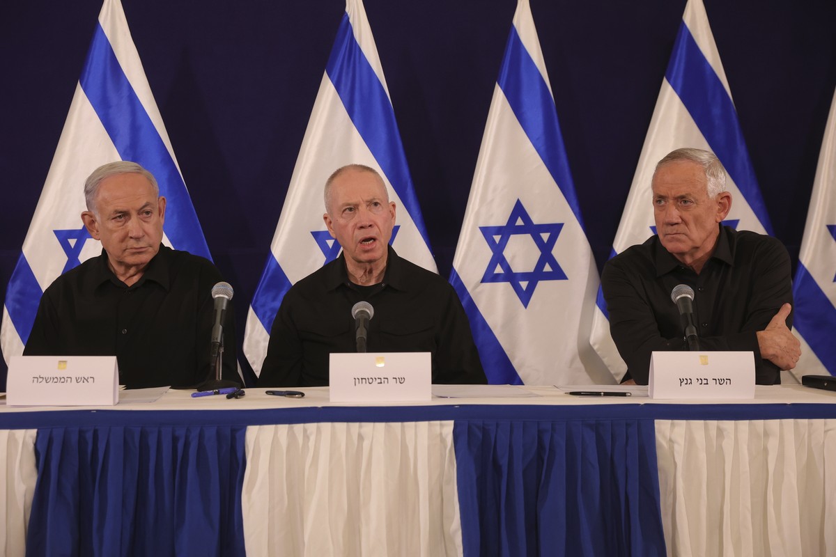 FILE - Israeli prime minister Benjamin Netanyahu, Defense Minister Yoav Gallant and Cabinet Minister Benny Gantz speak during a news conference in the Kirya military base in Tel Aviv, Israel on Saturd ...