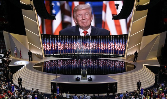 FILE - In this July 21, 2016, file photo, Republican presidential candidate Donald Trump smiles as he addresses delegates during the final day session of the Republican National Convention in Clevelan ...