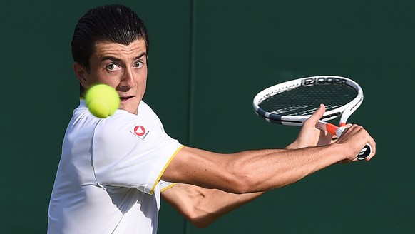 epa06066198 Sebastian Ofner of Austria returns to Thomaz Bellucci of Brazil in their first round match during the Wimbledon Championships at the All England Lawn Tennis Club, in London, Britain, 04 Ju ...