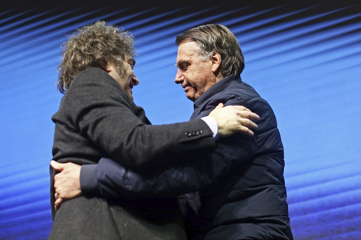 Argentina's President Javier Milei, left, hugs Brazilian former President Jair Bolsonaro during CPAC Brasil 2024, a conservative event, in Balneario Camboriu, Santa Catarina state, Brazil, Sunday ...