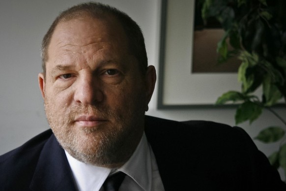 FILE - In this Nov. 23, 2011 file photo, film producer Harvey Weinstein poses for a photo in New York. Six women filed a federal lawsuit against Weinstein on Wednesday, Dec. 6, 2017, claiming that the ...