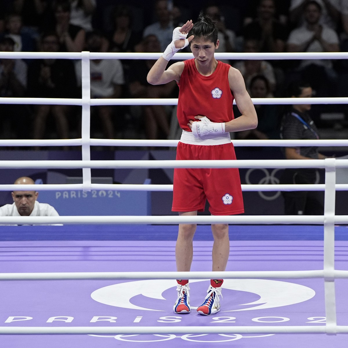 Taiwan's Lin Yu-ting reacts after defeating Bulgaria's Svetlana Staneva in their women's 57 kg quarterfinal boxing match at the 2024 Summer Olympics, Sunday, Aug. 4, 2024, in Paris, Fra ...