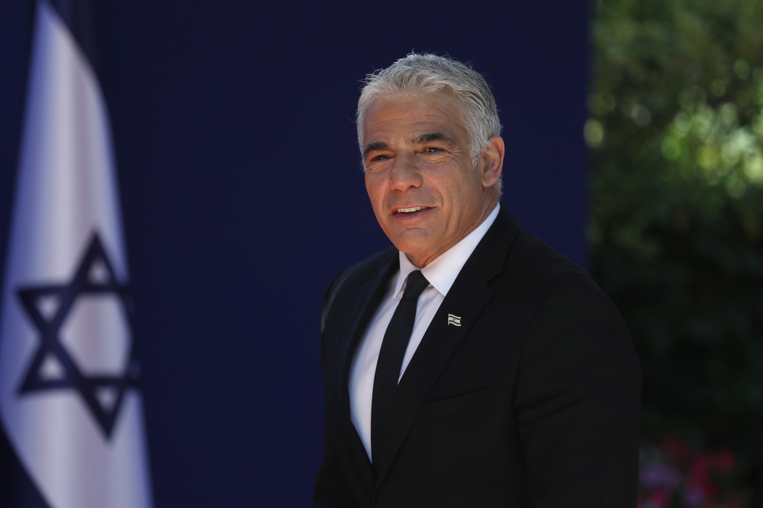 epa09269618 Alternate Prime Minister and Minister of Foreign Affairs Yair Lapid arrives at the Israeli President residence, for a joint photo with the new government ministers at the President&#039;s  ...