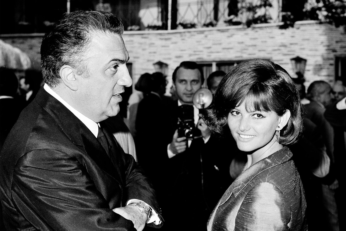 FILE - Italian actress Claudia Cardinale, right, and Italian film director Federico Fellini appear during an Academy Awards ceremony in Rome on May 27, 1964. (AP Photo/Giulio Broglio, File)
Obit Claud ...