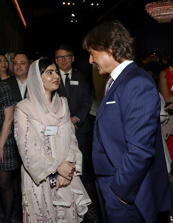 BEVERLY HILLS, CALIFORNIA - FEBRUARY 13: (L-R) Malala Yousafzai and Tom Cruise attend the 95th Annual Oscars Nominees Luncheon at The Beverly Hilton on February 13, 2023 in Beverly Hills, California.  ...