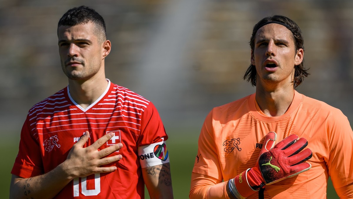 Switzerland's midfielder Granit Xhaka, left, and Switzerland's goalkeeper Yann Sommer, right, sing the national anthem during a friendly soccer match between Switzerland and Ghana in prepara ...