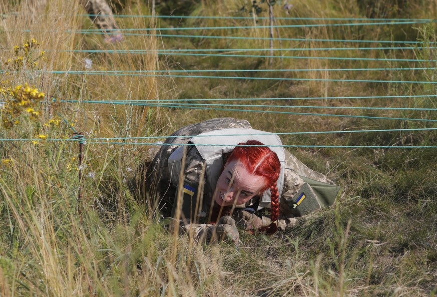 epa10741148 Ukrainian women attend the testing of a new women&#039;s military uniform during military training at a shooting range near Kyiv, Ukraine, 12 July 2023 amid the Russian invasion. Ukrainian ...