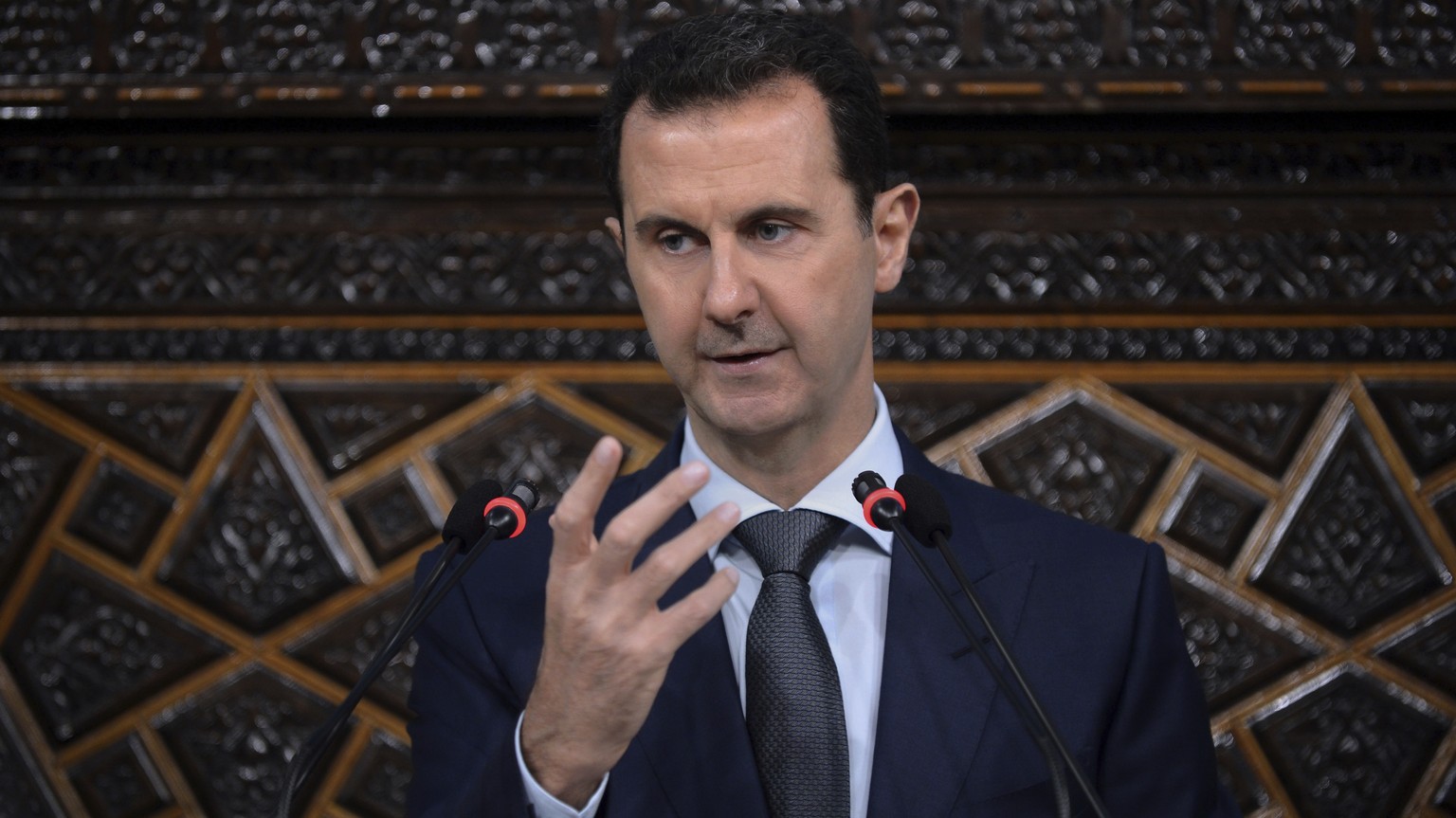 FILE - In this June 7, 2016 file photo released by the Syrian official news agency SANA, Syrian President Bashar Assad, addresses a speech to the newly-elected parliament at the parliament building, i ...