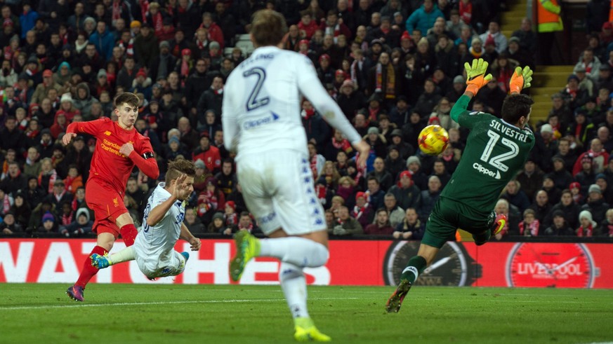 epa05652643 Liverpool’s Ben Woodburn (L) scores the second goal making the score 2-0 during the EFL Cup quarter final soccer match between Liverpool and Leeds United held at Anfield, Liverpool, Britai ...