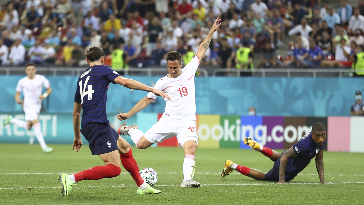 Switzerland&#039;s Mario Gavranovic, center, scores his side&#039;s third goal during the Euro 2020 soccer championship round of 16 match between France and Switzerland at the National Arena stadium,  ...