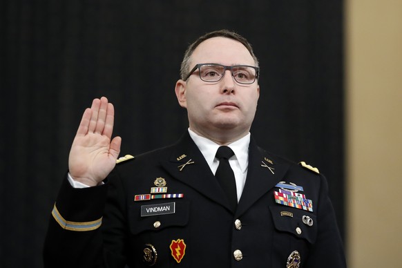 FILE - In this Nov. 19, 2019, file photo National Security Council aide Lt. Col. Alexander Vindman is sworn in to testify before the House Intelligence Committee on Capitol Hill in Washington during a ...