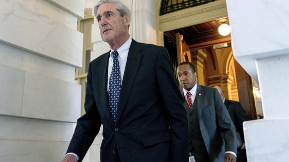 FILE - In this June 21, 2017, file photo, former FBI Director Robert Mueller, the special counsel probing Russian interference in the 2016 election, departs Capitol Hill following a closed door meetin ...