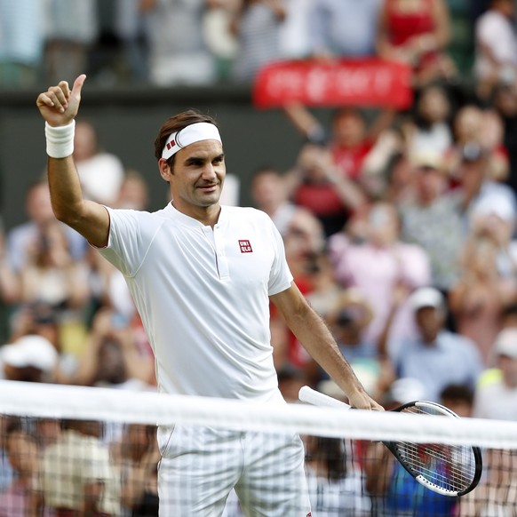 epa06869327 Roger Federer of Switzerland celebrates his win over Jan-Lennard Struff of Germany in their third round match during the Wimbledon Championships at the All England Lawn Tennis Club, in Lon ...