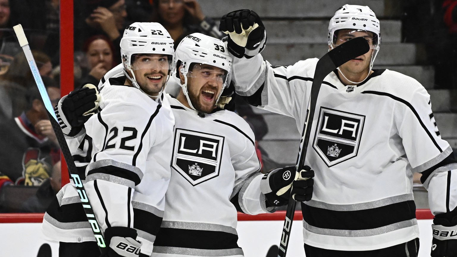 Los Angeles Kings right wing Viktor Arvidsson celebrates scoring his second goal of the game against the Ottawa Senators with teammates Kevin Fiala (22) and Matt Roy during the first period of an NHL  ...
