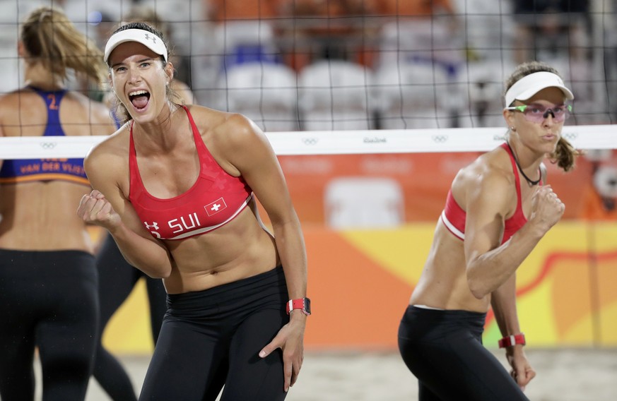 2016 Rio Olympics - Beach Volleyball - Women&#039;s Preliminary - Beach Volleyball Arena - Rio de Janeiro, Brazil - 11/08/2016. Joana Heidrich (SUI) of Switzerland and Nadine Zumkehr (SUI) of Switzerl ...