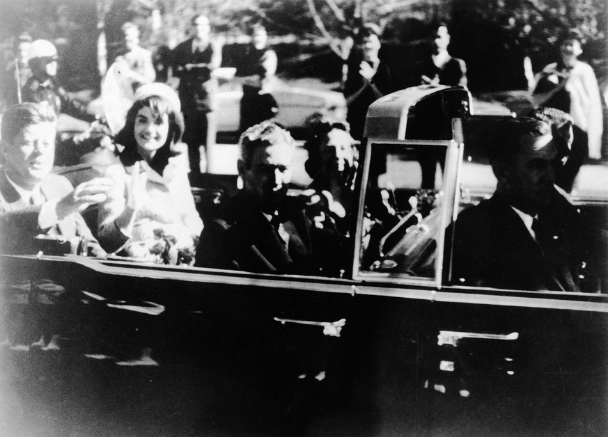 This image provided by the Warren commission, shows Warren Commission Exhibit No. 697, President John F. Kennedy at the extreme right on rear seat of his limousine during Dallas, motorcade on Nov. 22, ...