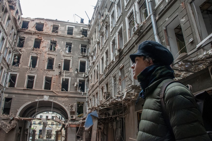 A local resident looks at his house destroyed in a Russian air raid in Kharkiv, Ukraine, Thursday, March 3, 2022. Russia&#039;s assault on Kharkiv, Ukraine&#039;s second largest city, continued Wednes ...