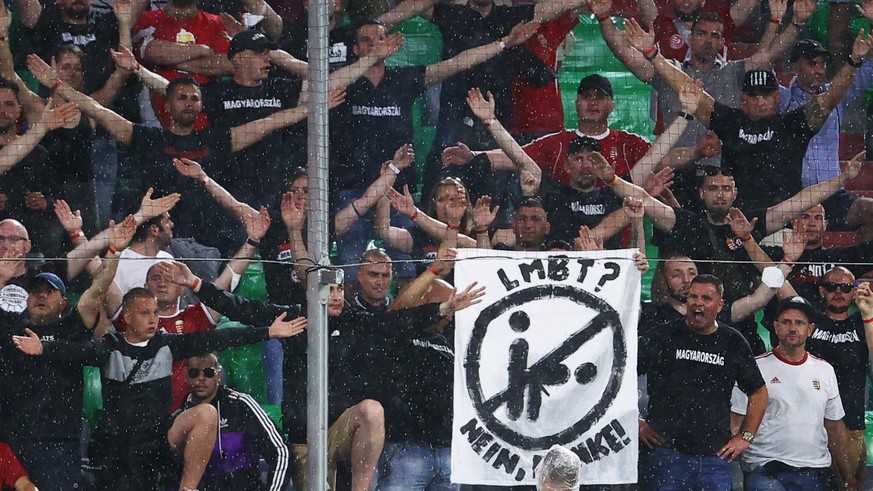 epa09296706 Supporters of Hungary show a placard during the UEFA EURO 2020 group F preliminary round soccer match between Germany and Hungary in Munich, Germany, 23 June 2021. EPA/Kai Pfaffenbach / PO ...