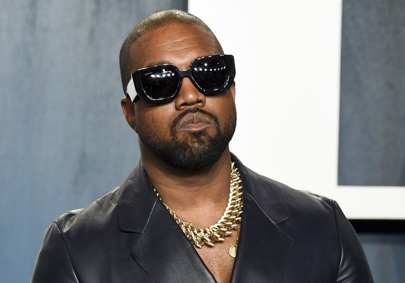 FILE - Kanye West arrives at the Vanity Fair Oscar Party on Feb. 9, 2020, in Beverly Hills, Calif. A surge of anti-Jewish vitriol, spread by a world-famous rapper
