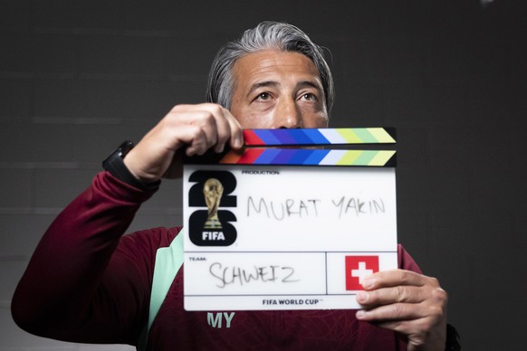 KEYPIX - Switzerland's head coach Murat Yakin holds a film clapperboard at the start of an interview with the FIFA after a press conference of the Swiss national soccer team at the SDJA in San Di ...