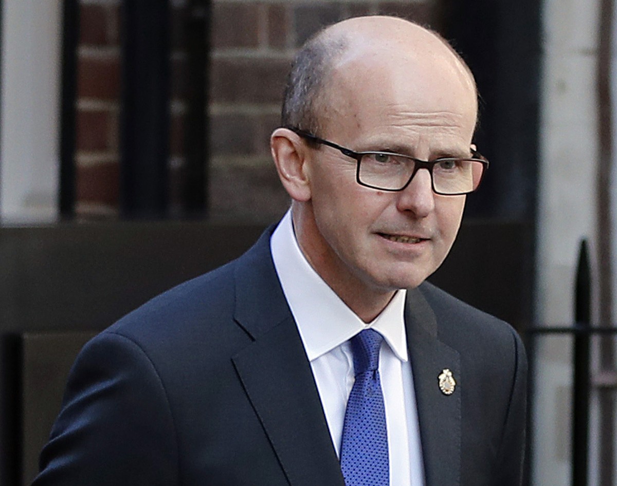 FILE - In this Feb. 14, 2019 file photo, Jeremy Fleming, head of the British Government Communications Headquarters (GCHQ) walks in London. Secret intelligence is playing an unusually public role in t ...