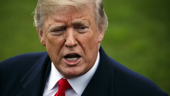 FILE- In this Nov. 26, 2018, file photo President Donald Trump speaks to members of the media before boarding Marine One on the South Lawn of the White House in Washington. According to a study in Mon ...