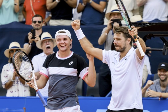 Stan Wawrinka, right, and Dominic Stricker, left, of Switzerland celebrate their victory against Marcelo Demoliner of Brazil and Matwe Middelkoop of Netherlands during their doubles final match at the ...
