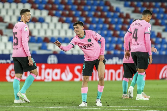 Barcelona&#039;s Pedri celebrates after scoring his side&#039;s second goal during the Spanish La Liga soccer match between Levante and FC Barcelona at the Ciutat de Valencia stadium in Valencia, Spai ...