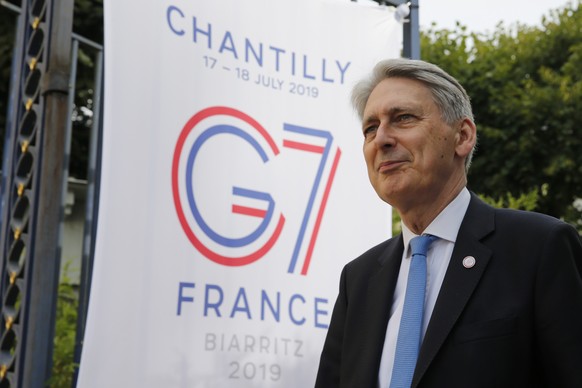 epa07724143 British Chancellor of the Exchequer, Philip Hammond, arrives to attend an interview during the G7 finance ministers and central bank governors meeting in Chantilly, near Paris, France, 18  ...