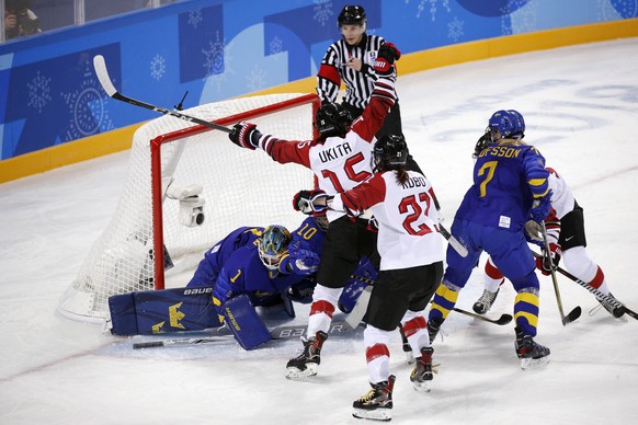 Rui Ukita (15), of Japan, reacts as she scores a goal against Sweden during the second period of the preliminary round of the women&#039;s hockey game at the 2018 Winter Olympics in Gangneung, South K ...