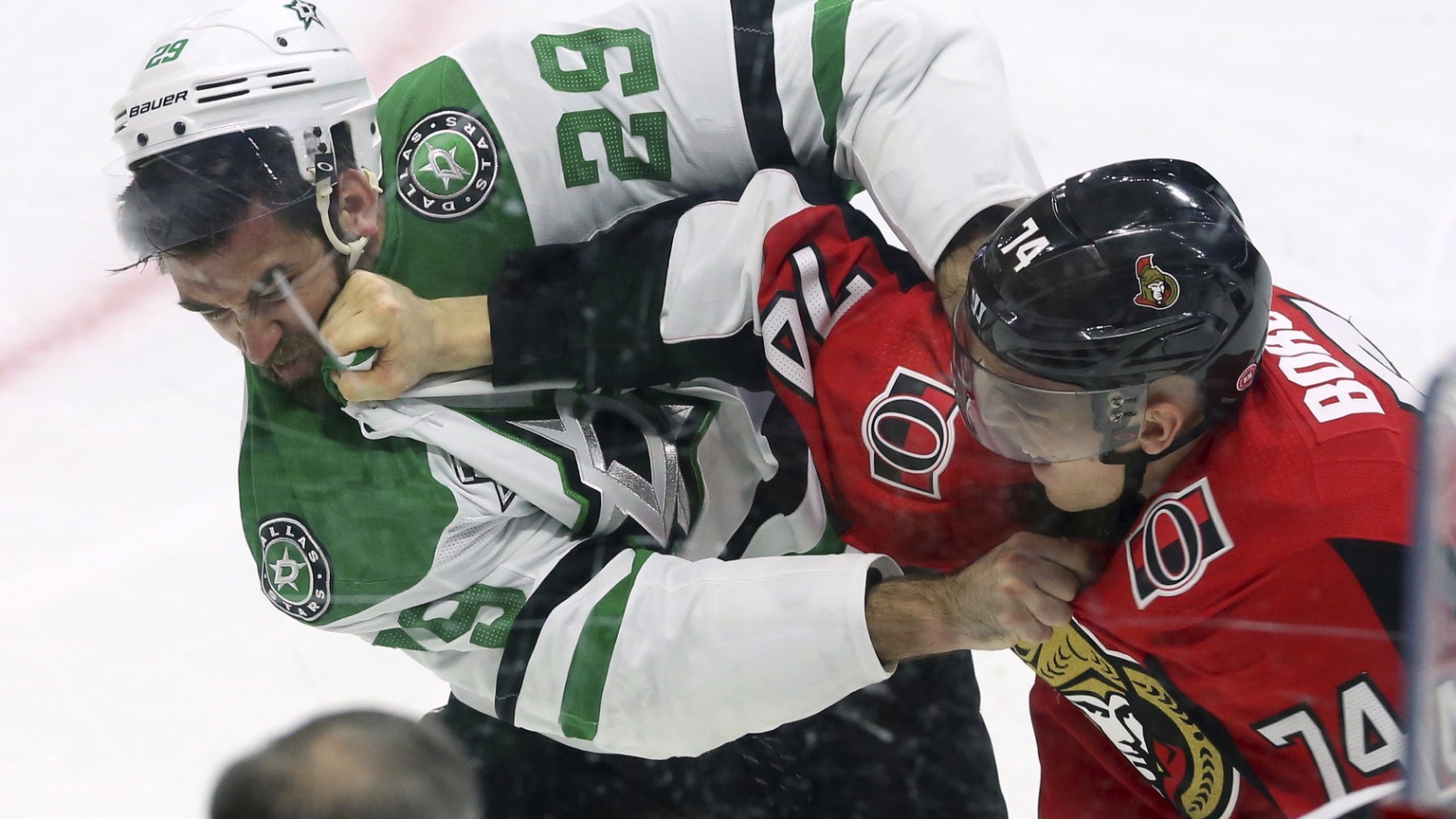 Ottawa Senators defenseman Mark Borowiecki (74) and Dallas Stars defenseman Greg Pateryn (29) trade punches during the first period of an NHL hockey game Friday, March 16, 2018, in Ottawa, Ontario. (F ...