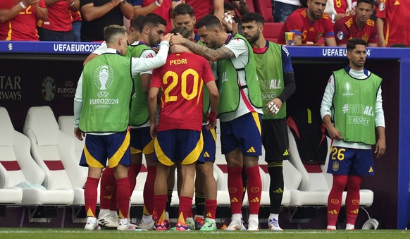 Spain&#039;s Pedri (20) is consoled by teammates after he was taken out of the game following an injury in a quarterfinal match between Germany and Spain at the Euro 2024 soccer tournament in Stuttgar ...