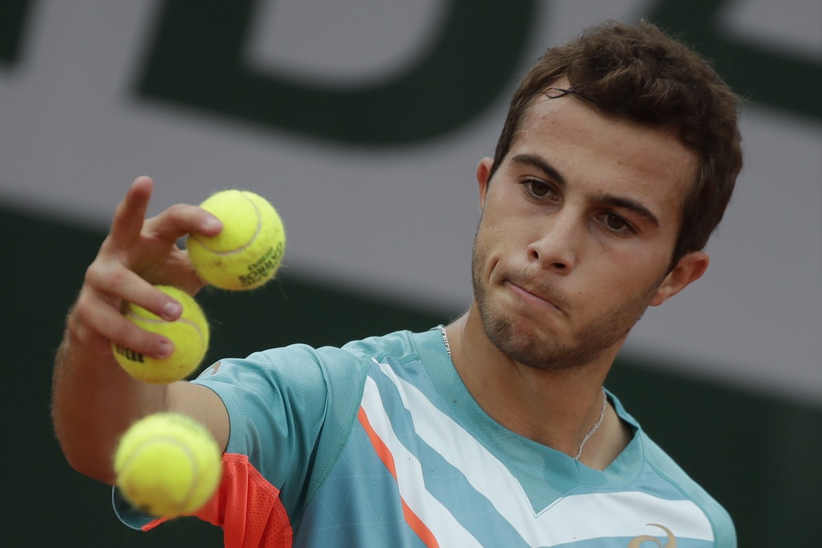FILE - France's Hugo Gaston prepares to serve against Japan's Yoshihito Nishioka in the second round match of the French Open tennis tournament at the Roland Garros stadium in Paris, France, ...