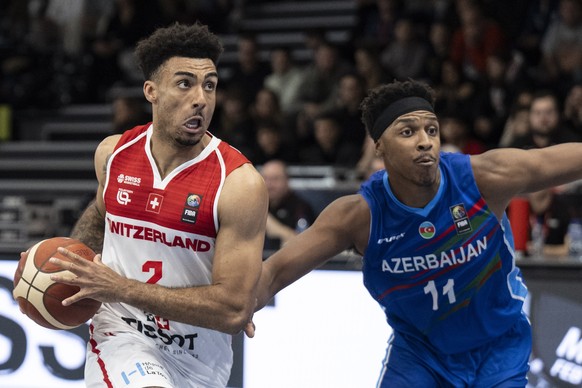 Switzerland&#039;s Anthony Polite, left, in action against Azerbajan&#039;s Zachary Vincent Leday during the FIBA Basketball World Cup 2027 European Pre-Qualifiers game between Switzerland and Azerbaj ...