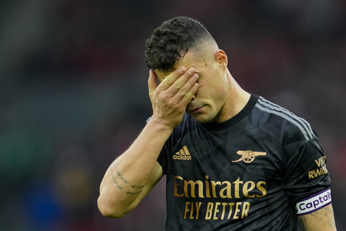 Arsenal's Granit Xhaka reacts at the end of the English Premier League soccer match between Liverpool and Arsenal at Anfield in Liverpool, England, Sunday, April 9, 2023. (AP Photo/Jon Super)