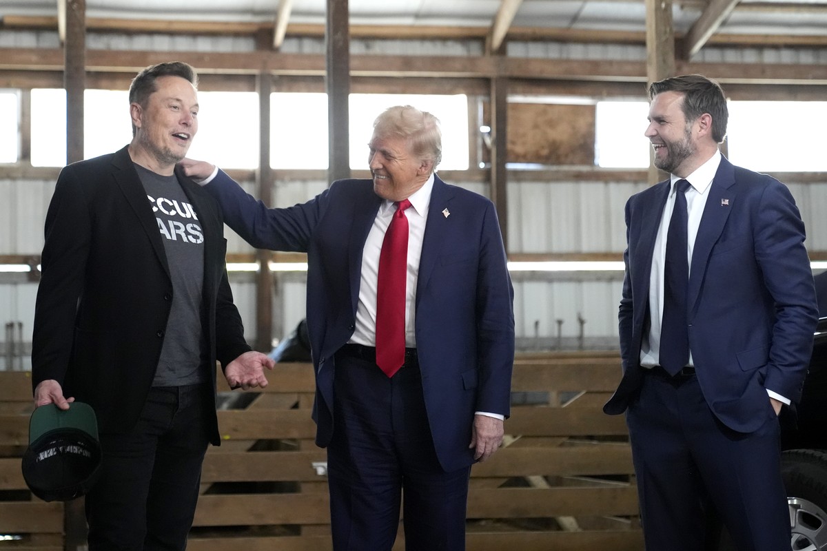 FILE - Tesla and SpaceX CEO Elon Musk, from left, Republican presidential nominee, former President Donald Trump and Republican vice presidential nominee, Sen. JD Vance, R-Ohio, attend a campaign even ...