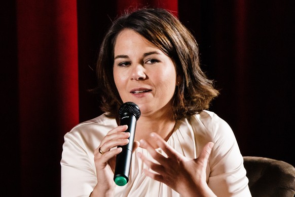 epa09449351 Green party (Die Gruenen) co-chairwoman and top candidate for the upcoming federal elections Annalena Baerbock gestures during a podium discussion at Thalia Babelsberg cinema in Potsdam, G ...